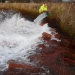 Sampling a pumped outflow from an abandoned coal mine in East Lothian. BGS © UKRI.