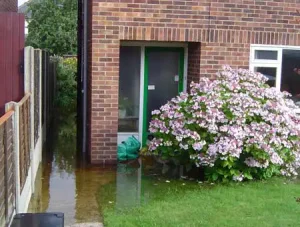 House and garden flooded by rising groundwater, July 2007. BGS © UKRI.