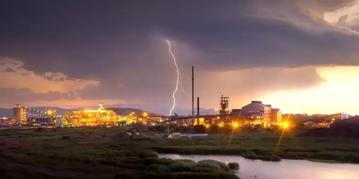 Union Mine - An exterior view showing a lightening strike over the Mortimer Concentrator and Smelter complex - Taken at dusk. © Anglo American