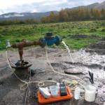 Figure 2. Measuring groundwater chemistry at a newly drilled well.