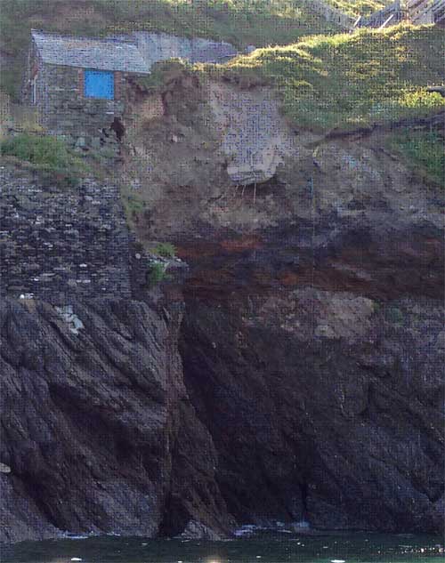 The collapsed barn and landslide scar in May 2012. A cave extending underneath the stone barn and landslide can clearly be seen.