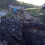 Landslide scar and proximity to the village access road and viewing platform.