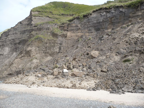 Failure of material from the cliff in Nefyn Bay.