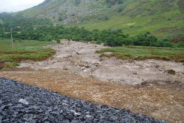 Debris fan at base of slope.