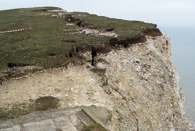 Tension crack at top of cliffs.