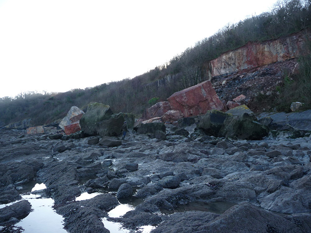 The Oxwich Bay landslide. Note geologist for scale with ' The Dices' in the foreground.