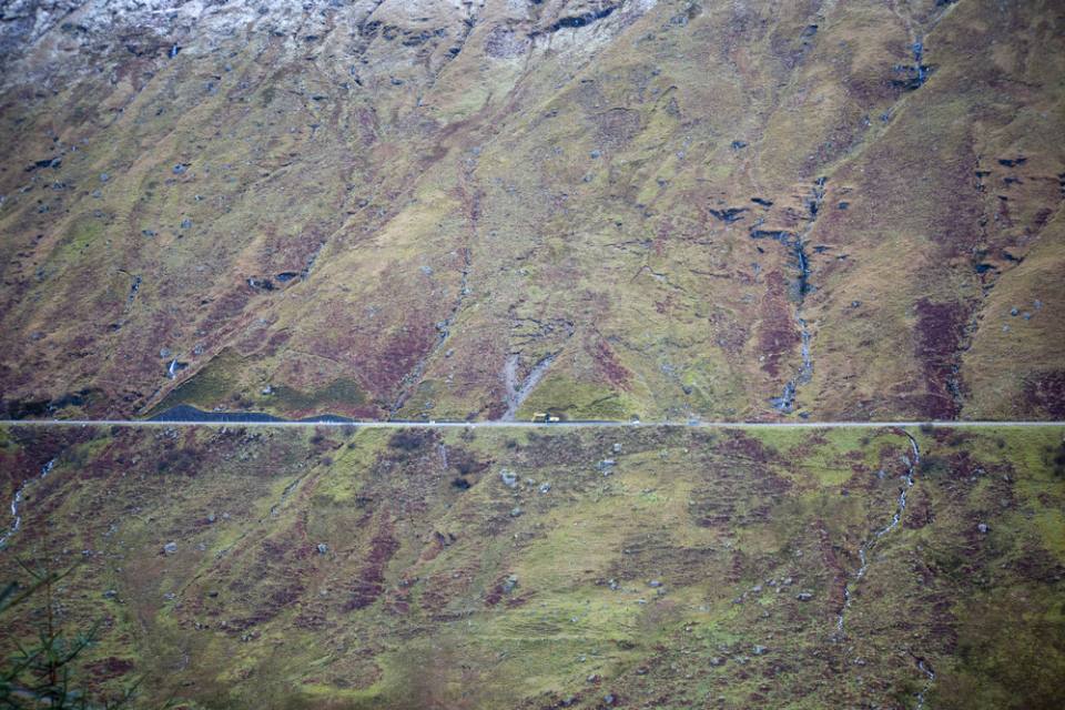 Numerous tension cracks in slope surrounding 2011 landslide.