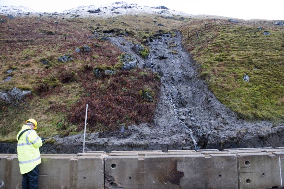 Lower portion of 2011 slide with water emanating from gully.