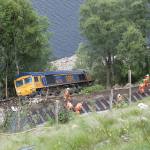 Derailed engine below the rail track.