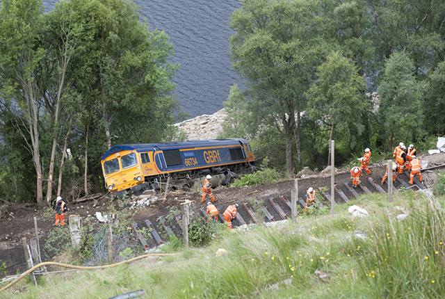 Derailed engine below the rail track.