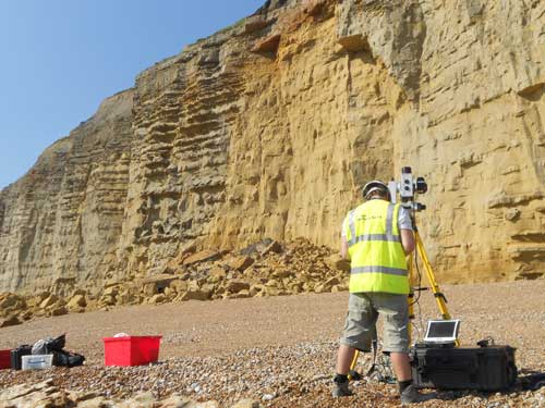 The British Geological Surveys' Landslide Response Team map the collapsed cliff from a safe distance using a LiDAR, laser, scanner. Taken 25 July 2012.