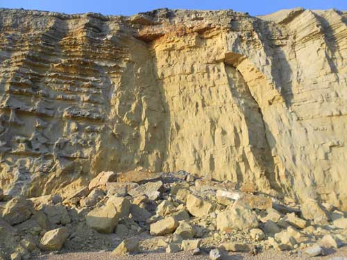 The British Geological Surveys' initial findings suggest the recent heavy rain was a contributing factor that caused the rock fall at Barton Bradstock. Taken 25 July 2012.