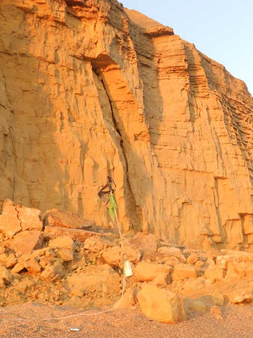 Wide cracks are visible in the rock face and leave unsupported blocks of rock free to fall. Taken 25 July 2012.