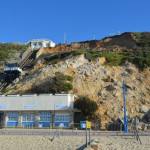 Landslide at East Cliff, Bournemouth, 24 April 2016. East Cliff lift (funicular) on far left, café on left and destroyed toilet on right. Undercliff Drive in foreground.