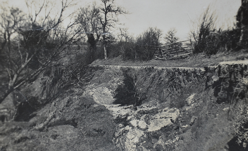 The backscarp of the 1947 reactivation. The driveway to the farm has been damaged. Photo courtesy of Hereford Times.