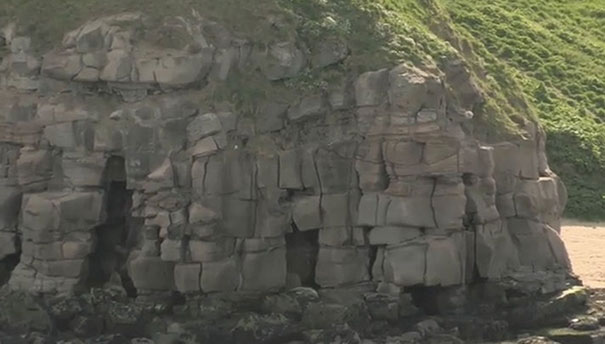 Detail of the cliffs of the Pen Bal Crag headland clearly showing how joints and bedding planes of the local sandstone combine to create a vertical slope that is very susceptible to large rockfall.