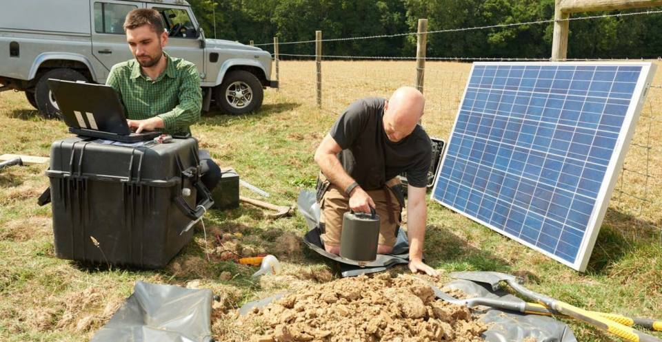 Two BGS scientists installing seismometers in Surrey