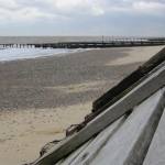 Coastal defence measures at Hopton-on-sea, Norfolk, UK: wooden revetments and groynes.
