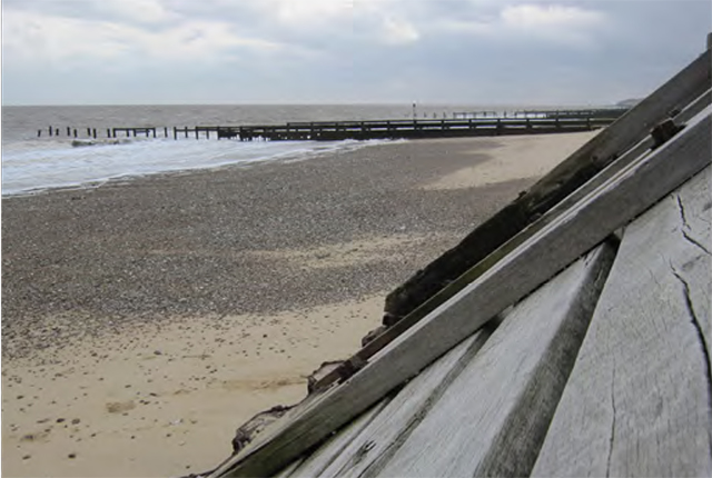 Coastal defence measures at Hopton-on-sea, Norfolk, UK: wooden revetments and groynes.