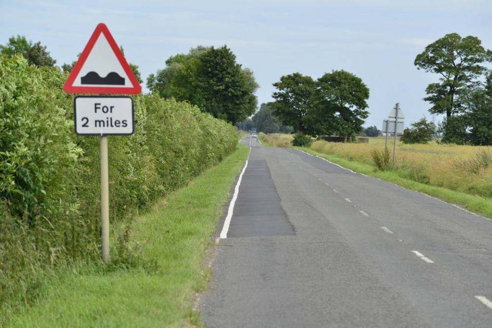 Shrink-swell ground movement on road