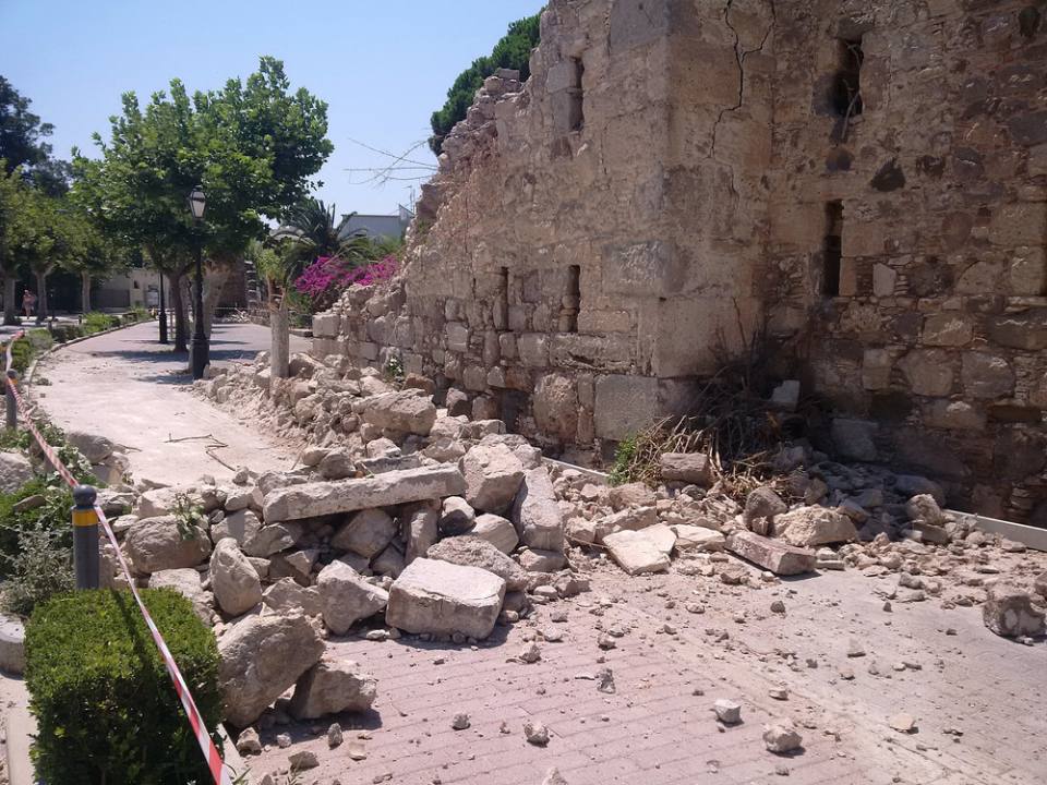 Rubble from an old building lies in a street after the 2017 earthquake on the Greek island of Kos