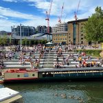 People on the steps at Regent's Canal, Granary Square, King's Cross, London. Source: VVShots/iStock 2020.