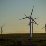 Wind turbines against a twilight sky