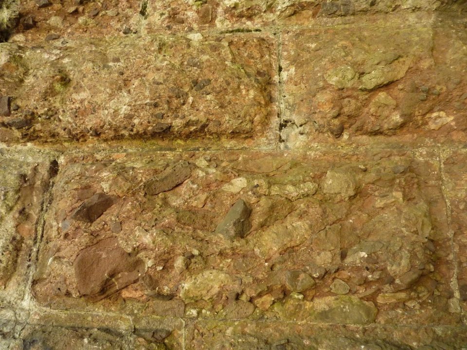 Blocks of Radyr Stone on a bridge pillar, showing pebbles in a yellowish matrix