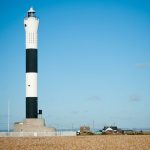 A black and white striped lighthouse