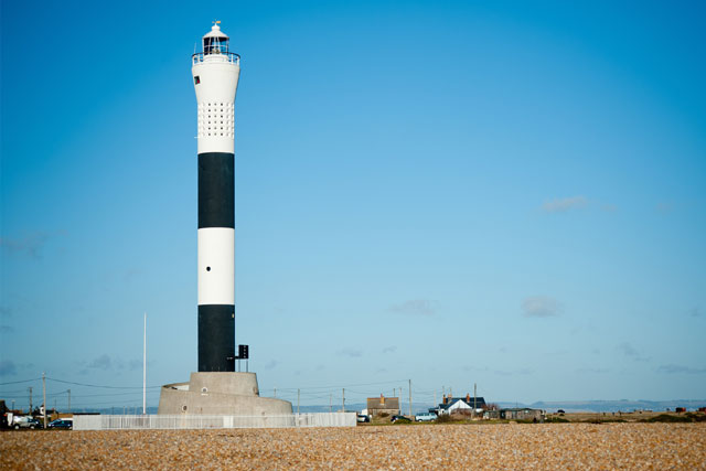 A black and white striped lighthouse