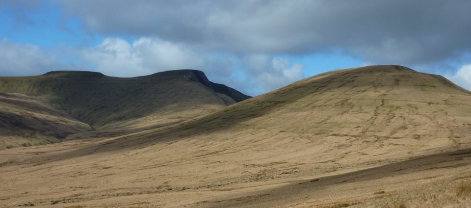 A panorama of three flat-topped hills
