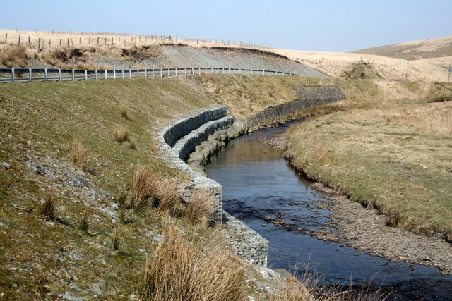 River bank reinforcement. © Copyright Roger Whittleston and licensed for reuse under this Creative Commons Licence.