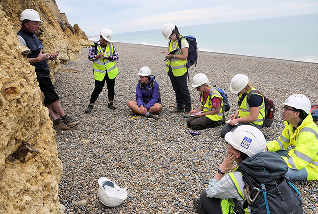 Discussing the finer details of the periglacial alteration of the chalk at Weybourne. Emrys Phillips, BGS © UKRI.