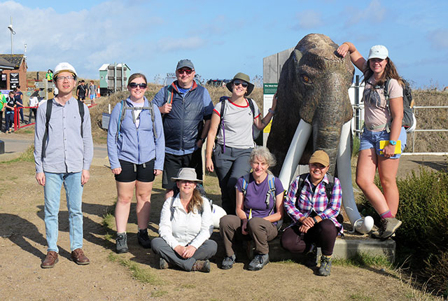 The team at West Runton. Back row, left to right: Xiaoyang Wu; Catriona Macdonald; Jon Lee; Laura Burrel; Mammoth; Rowan Vernon. Front row: Rhian Kendall; Sarah Arkley; Raushan Arnhardt. Emrys Phillips, BGS © UKRI.