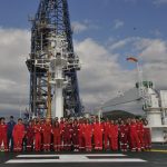 The ECORD IODP Expedition 386 Research Team on the helideck of The Chikyu research vessel.