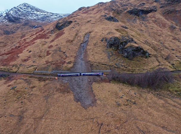 This debris flow covered railway tracks and caused the derailment of a passenger train on the West Highland line between Glasgow and Mallaig in the Scottish Highlands, near Loch Eilt. Image source: Rail Accident Investigation Branch report 10/2018: Landslip and derailment at Loch Eilt. © Crown copyright 2022.