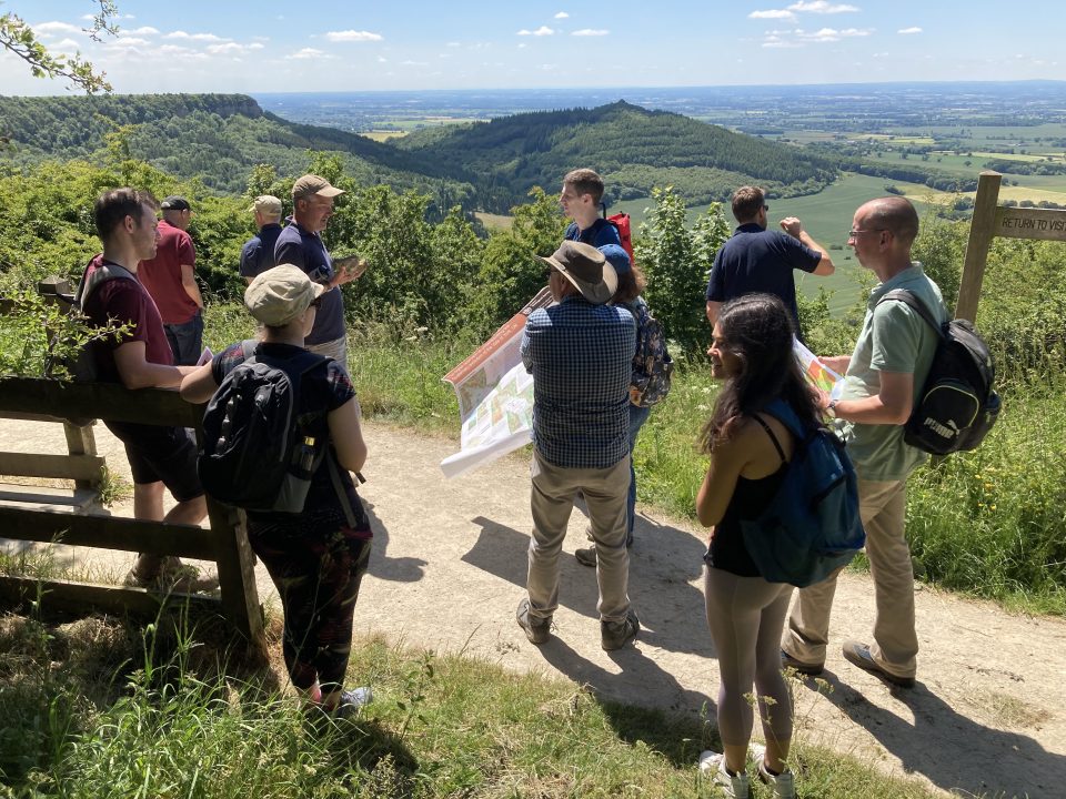 BGS hazard products team atop Sutton Bank discussing the glacial history of the Vale of York BGS © UKRI