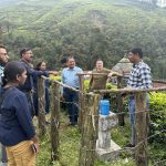 Rajkumar Mathazhagalan from the Geological Survey of India (GSI) is explaining to the other workshop participants from the University of Kerala, College of Engineering Goa, Indian Institute of Technology Palakkad, Andhra University, and BGS the available rain gauge data information near the Pettimudi landslide in Kerala, which happened in 2020 and caused 66 fatalities of residents. Credit Nikhil Nedumpallile Vasu BGS / UKRI.