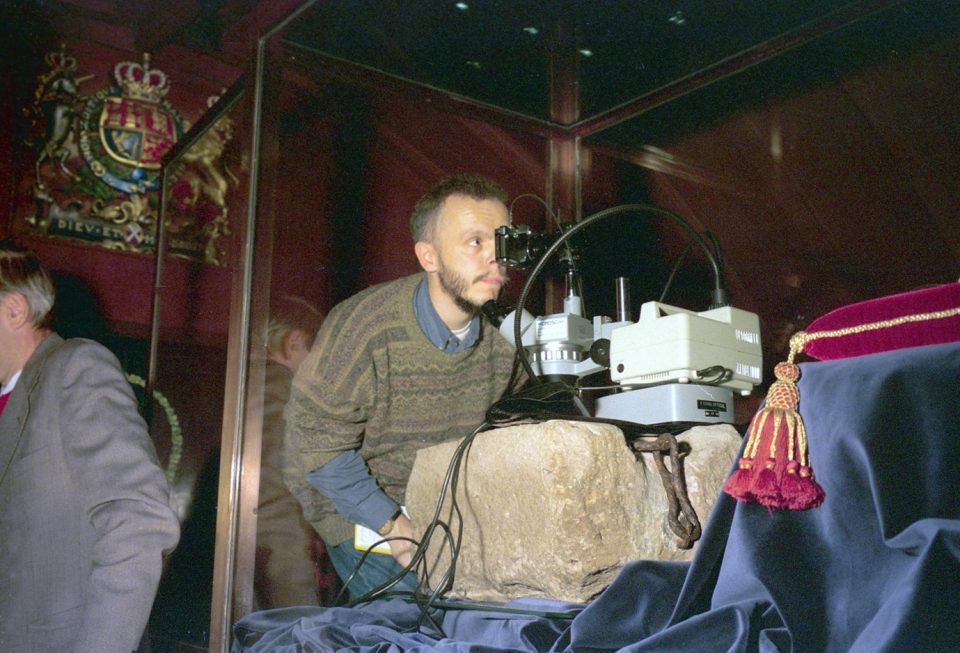 BGS’s Emrys Phillips examining the Stone of Scone at Edinburgh Castle in 1998. BGS © UKRI.