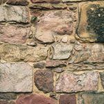 Detail of a building in Thistle Court, Edinburgh, built around 1768 and one of the oldest buildings in the Edinburgh New Town. The stone is a mixture of locally derived material, with pale yellow-buff and pink sandstones and darker reddish-purple igneous rocks. BGS © UKRI.