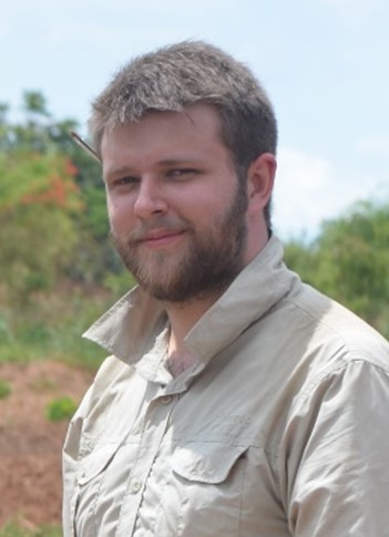 A man with light brown hair and beard