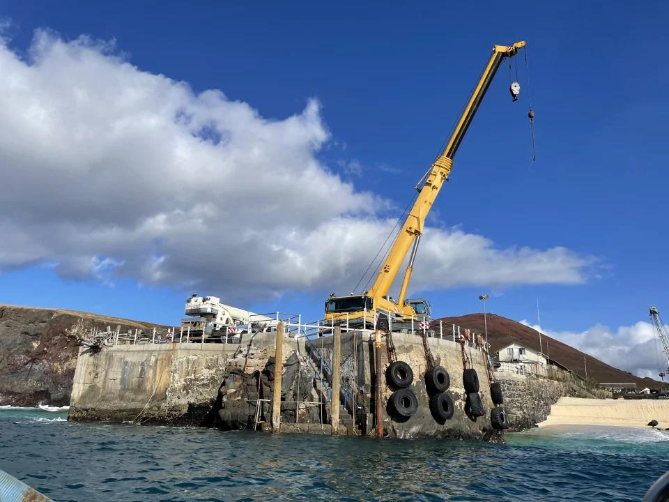 Crane launch of the boat and survey equipment. ©AIG/Lorna.