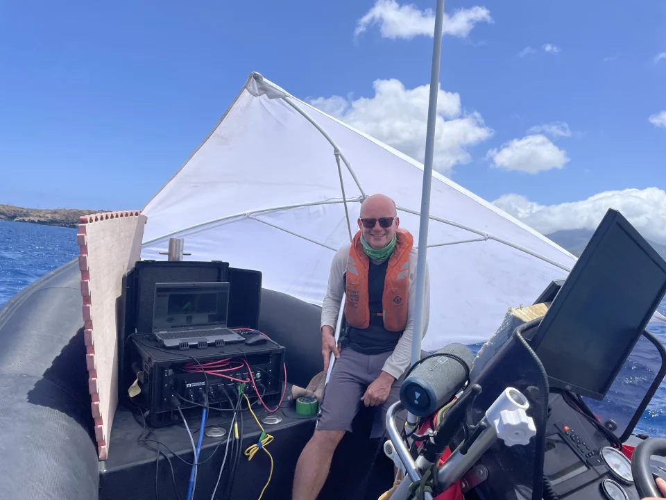 Taking shelter from the sun on the boat © Rhys Cooper