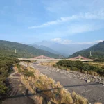 Kaoping River in Pingtung County, with the foothills of the central highlands in the background. The Kaoping River has the largest drainage area of any river in Taiwan and a mean flow of 268 m3 per second. Even at the start of the of the dry season in mid-November, there was no surface flow. © Jon Mackay