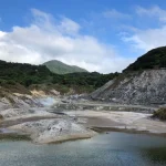 Fumaroles (gas vents) and sulphur deposits (yellow patches) at Sulphur Springs Valley, Yangmingshan National Park. © John Bloomfield