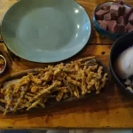 Sampling the local chikanda, nshima and fried okra. © Rachel Talbot. 