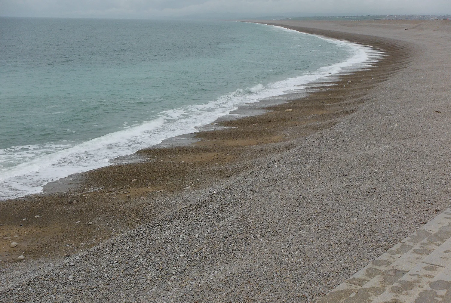 A curved shingle beach