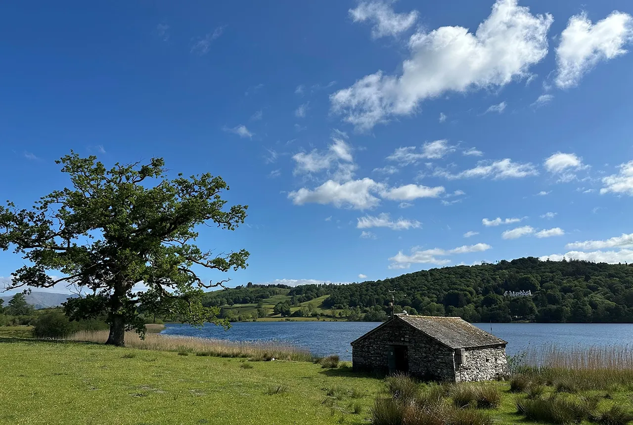 Esthwaite Water looking beautiful in early summer sunshine. UKCEH and its partners have been sampling and monitoring many of the lakes in the English Lake District, including Esthwaite Water, for several decades. BGS © UKRI.