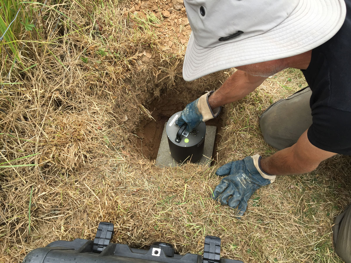 BGS scientist installing seismic monitoring equipment. BGS © UKRI