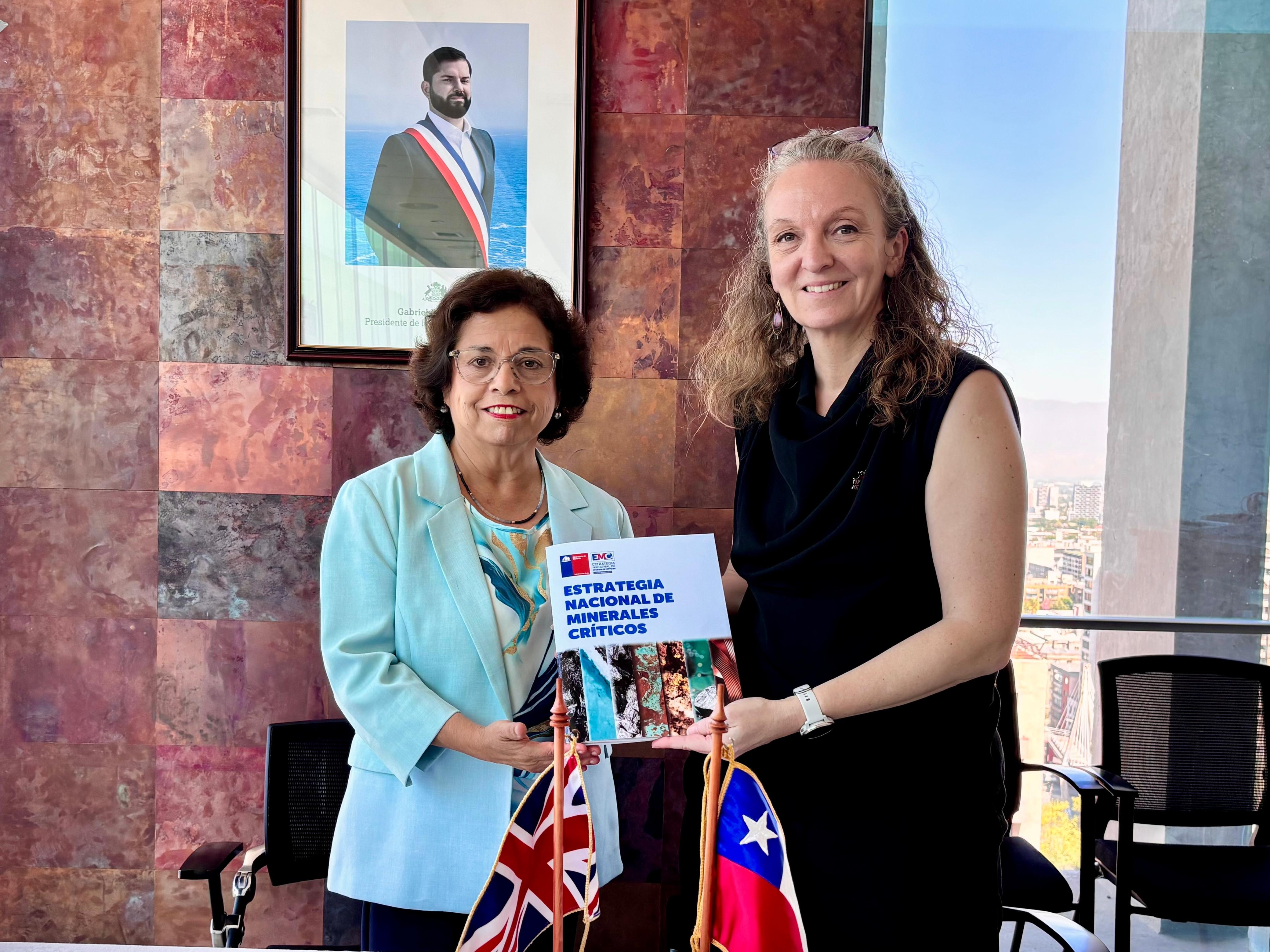 Minister of mining, Aurora Williams handing the Chile critical minerals strategy to BGS director of international geoscience, Maggy Heintz